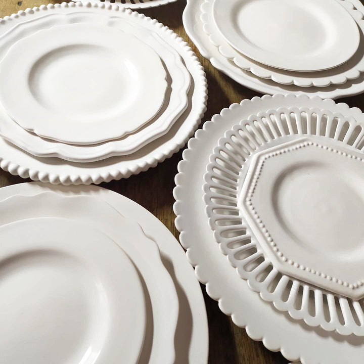 Assorted handmade plates by Bourg-Joly Malicorne