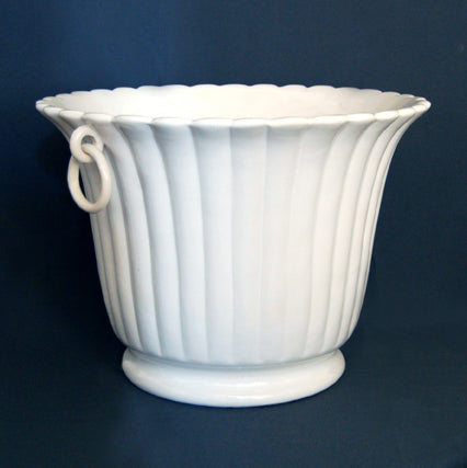 Fluted white earthenware planter side view