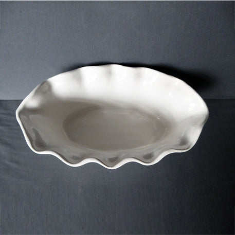 Oval scalloped earthenware planter top view