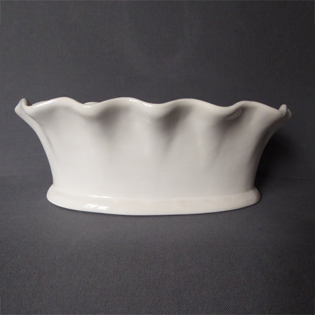 Oval scalloped earthenware planter side view