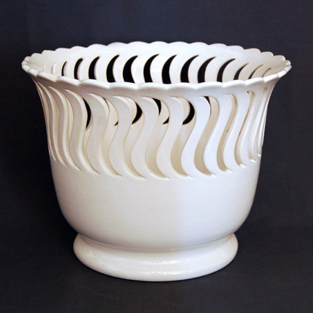Ceramic planter with S shaped openwork side view