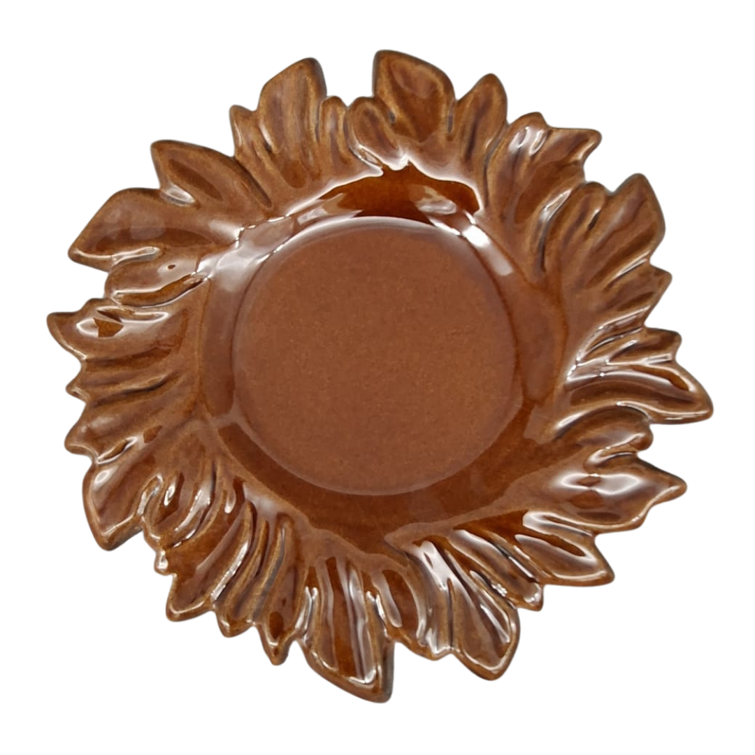 Brown glazed plate with Acanthus leaf patterned edge.