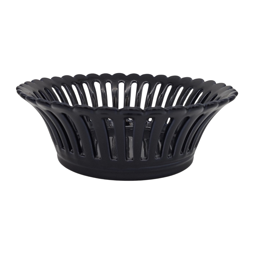 A navy blue glaze ceramic basket with a fluted, scalloped rim and vertical openwork, shown on a plain white background.
