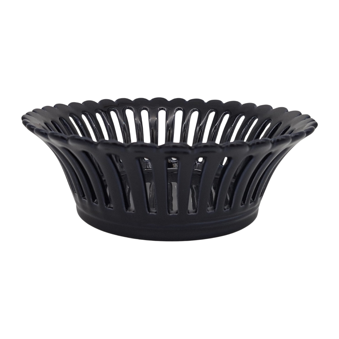 A navy blue glaze ceramic basket with a fluted, scalloped rim and vertical openwork, shown on a plain white background.