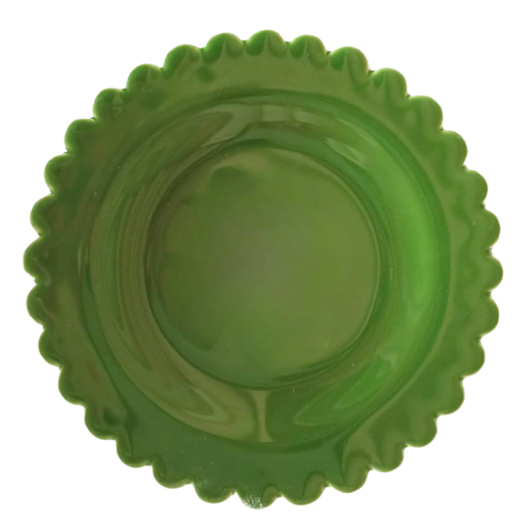 A leaf green earthenware plate with a scalloped rim, photographed from directly above on a white background.