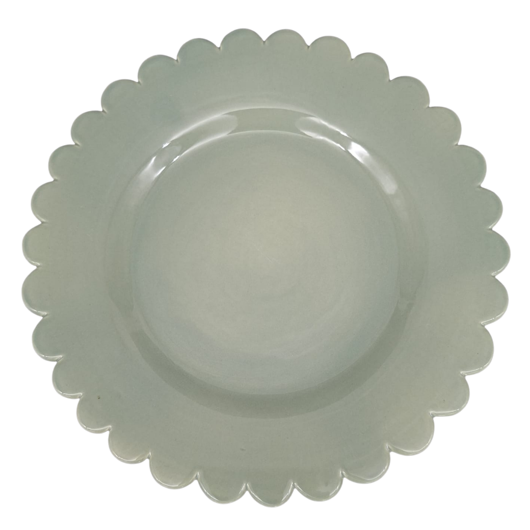 A Sage green round ceramic plate with a scalloped edge, shown from a top-down view on a plain white background.