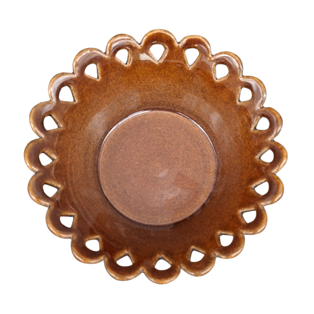 A round ceramic dish with a scalloped, lacy cutout rim and a smooth, glossy brown center, shown from a top-down perspective on a white background.