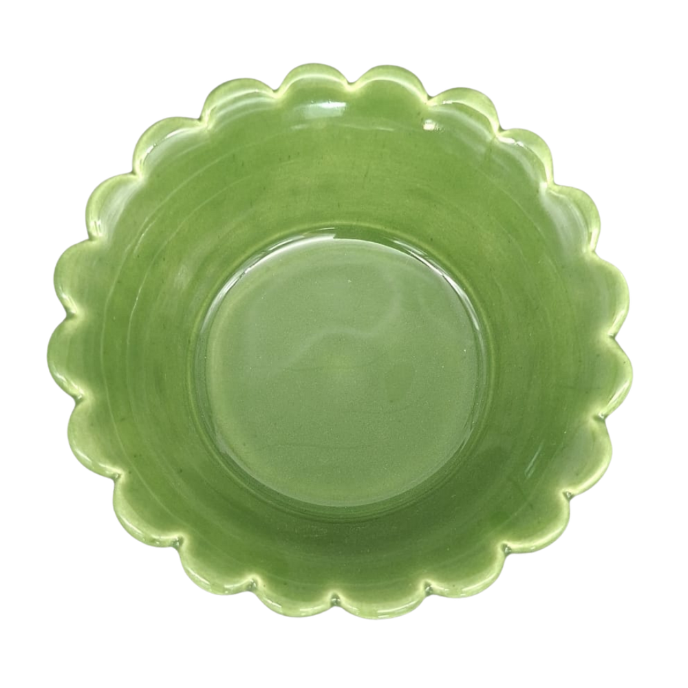 A leaf green ceramic plate with a scalloped rim, photographed from directly above on a white background.