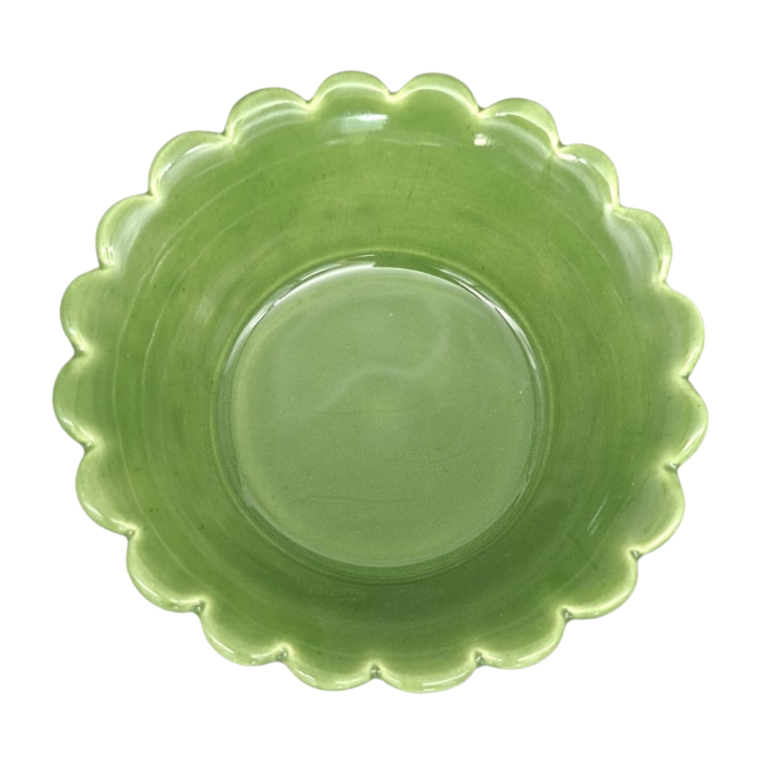 A leaf green ceramic plate with a scalloped rim, photographed from directly above on a white background.