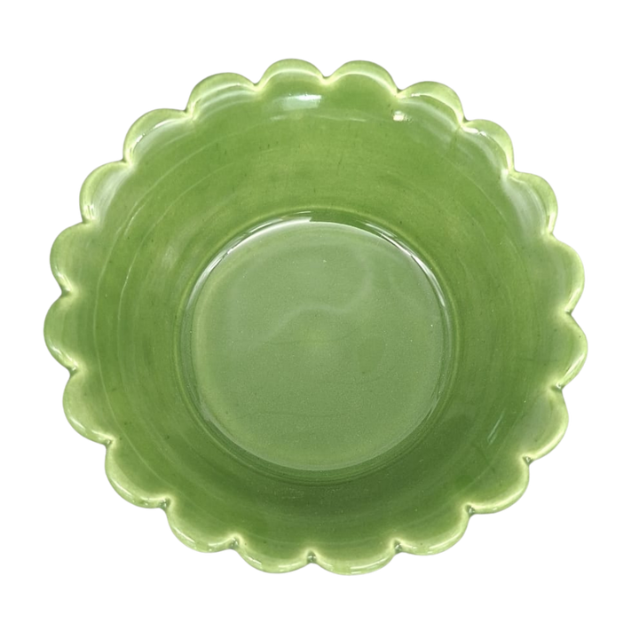 A leaf green ceramic plate with a scalloped rim, photographed from directly above on a white background.