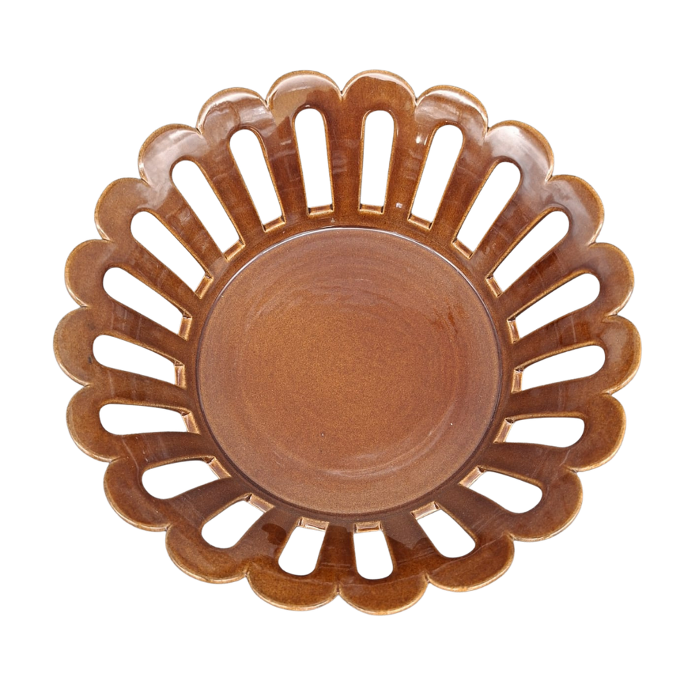 A round ceramic basket with a scalloped edge and cutout slots, shown from a top-down view on a white background.