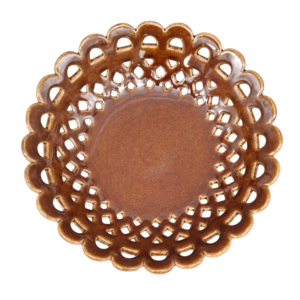 A round ceramic plate with a scalloped, openwork lattice edge and a smooth, glossy brown center, shown from a top-down perspective on a white background.