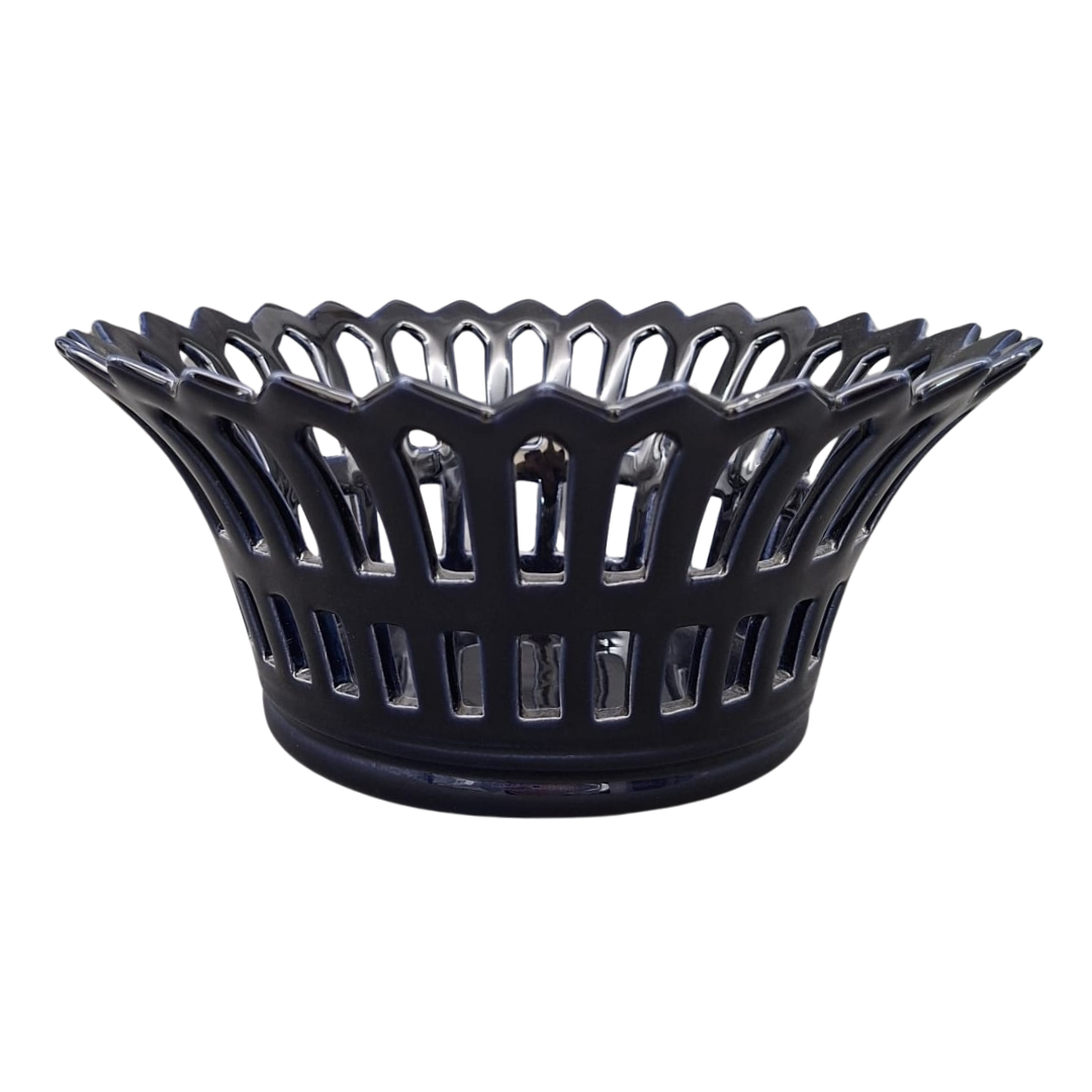 A glossy navy blue ceramic basket with a decorative fluted rim and vertical slotted cutout openwork, shown on a plain white background.