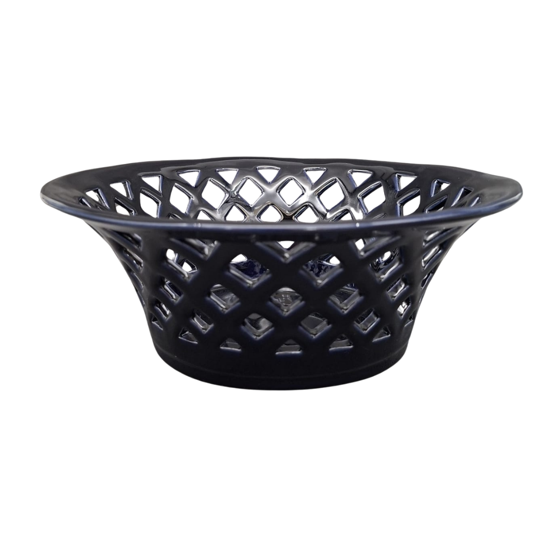 A navy blue glaze earthenware ceramic basket with a lattice cutout pattern, shown against a plain white background.