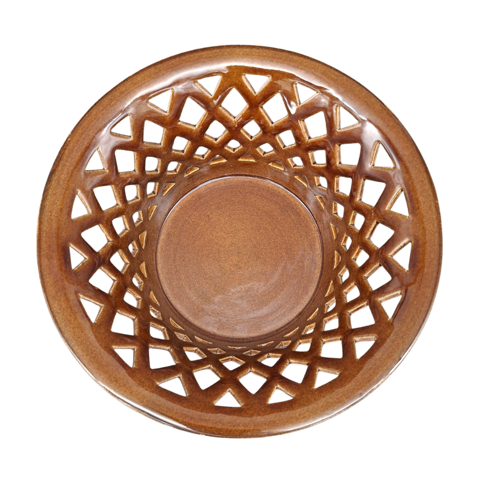 A round ceramic bowl with a brown lattice pattern on the outer rim, photographed from directly above on a white background.