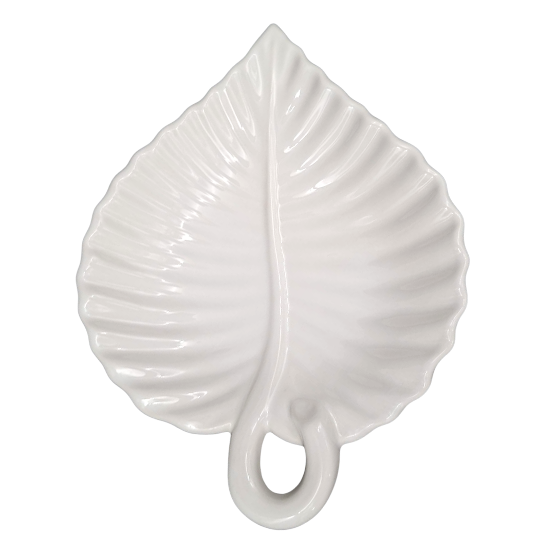 A white ceramic ribbed leaf-shaped dish with a glossy finish, featuring a detailed leaf vein pattern and a loop handle at the bottom, set against a plain white background.