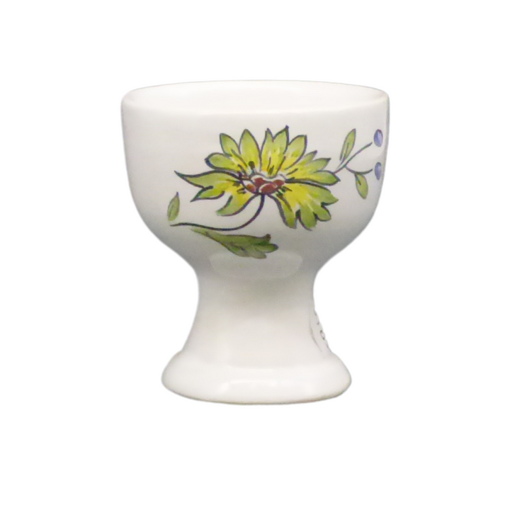 Simple egg cup with a polychrome hand painted bird and flower