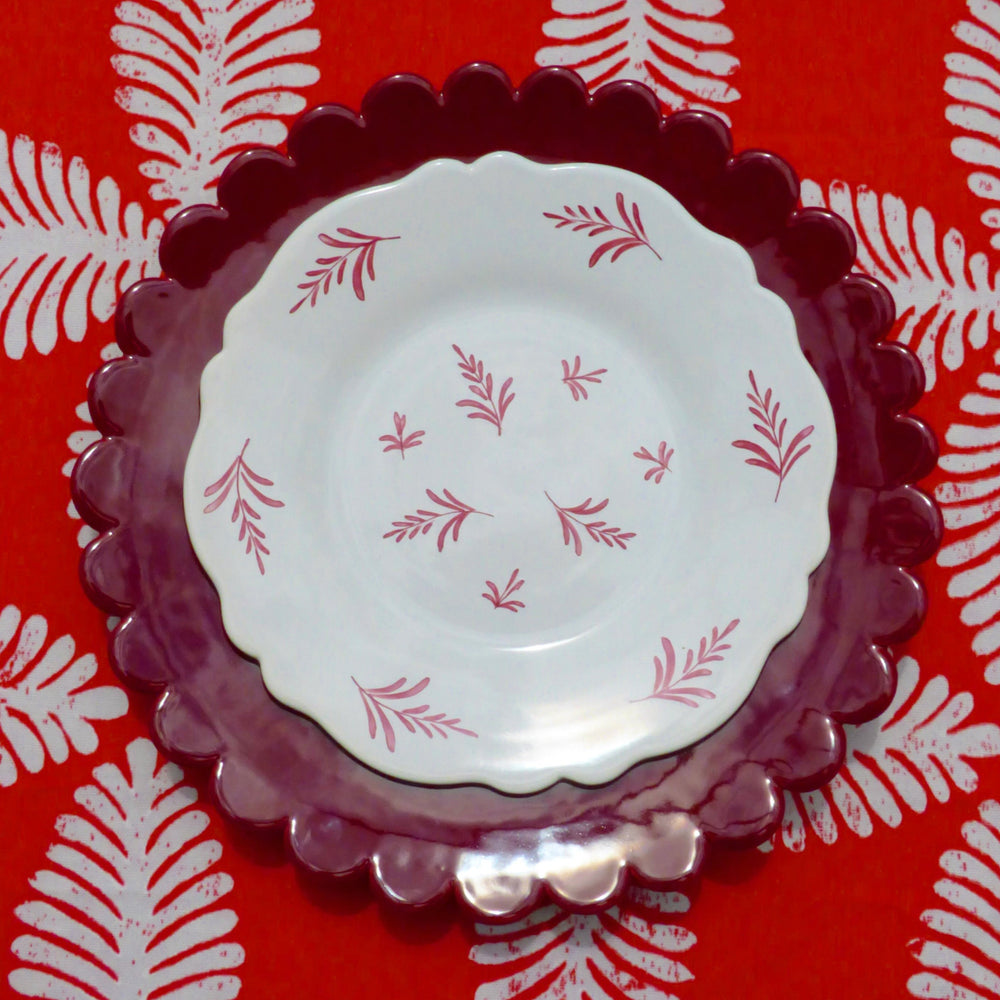 Scallop edge Chevet Pleine handmade plates in bordeaux glaze