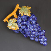 Bunch of earthenware blue grapes