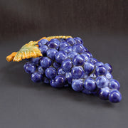 Bunch of earthenware blue grapes