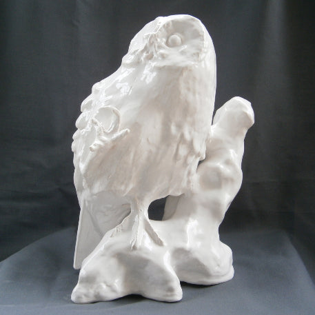 White Earthenware Owl with one claw raised