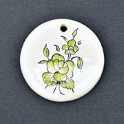 Earthenware Disc ornament with a hand painted flower motif