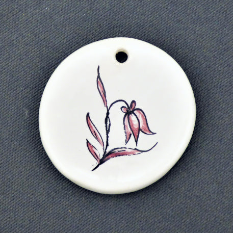 Earthenware Disc ornament with a hand painted flower motif