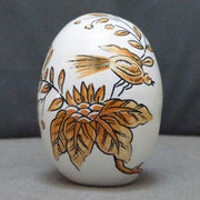 Egg with St Omer monochrome orange hand painted decoration