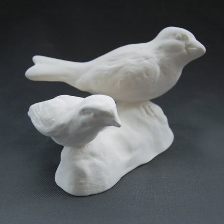 White earthenware small and large bird pair