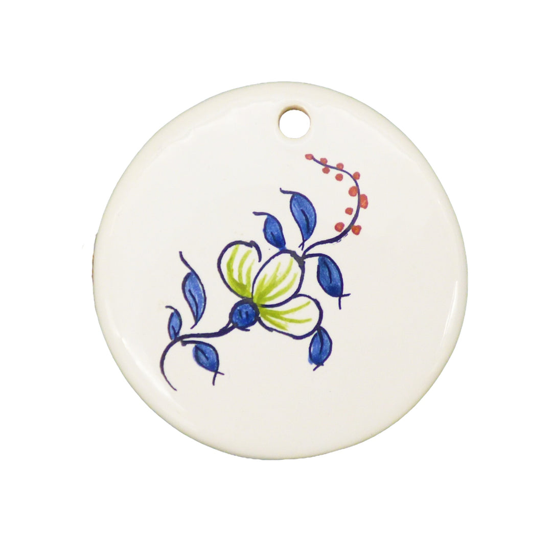 Disc ornament with a hand painted polychrome flower